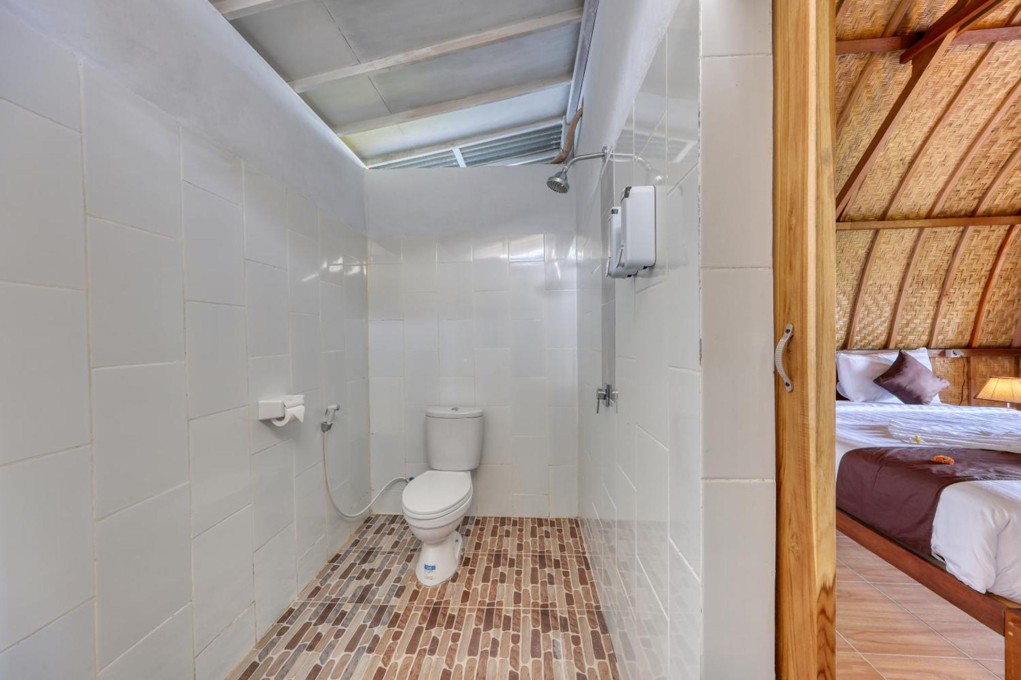 D Sebuluh Bungalow Batumadeg Номер фото
